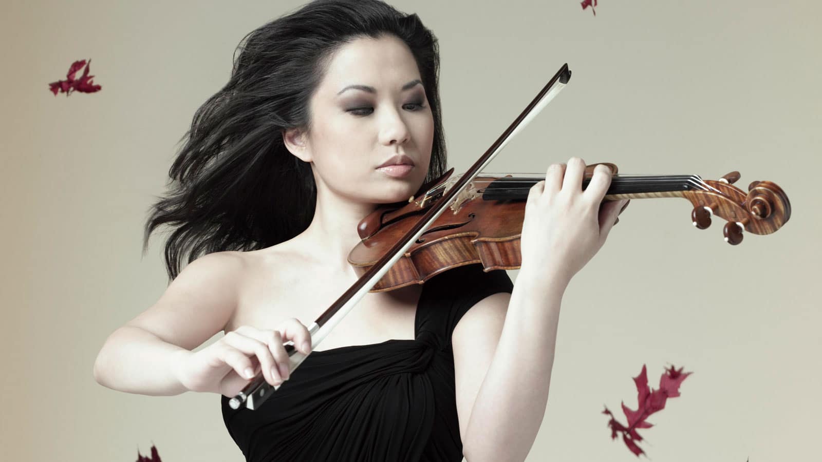 Violinist Sarah Chang holds her Guarneri violin in an Opus 3 Artists press portrait